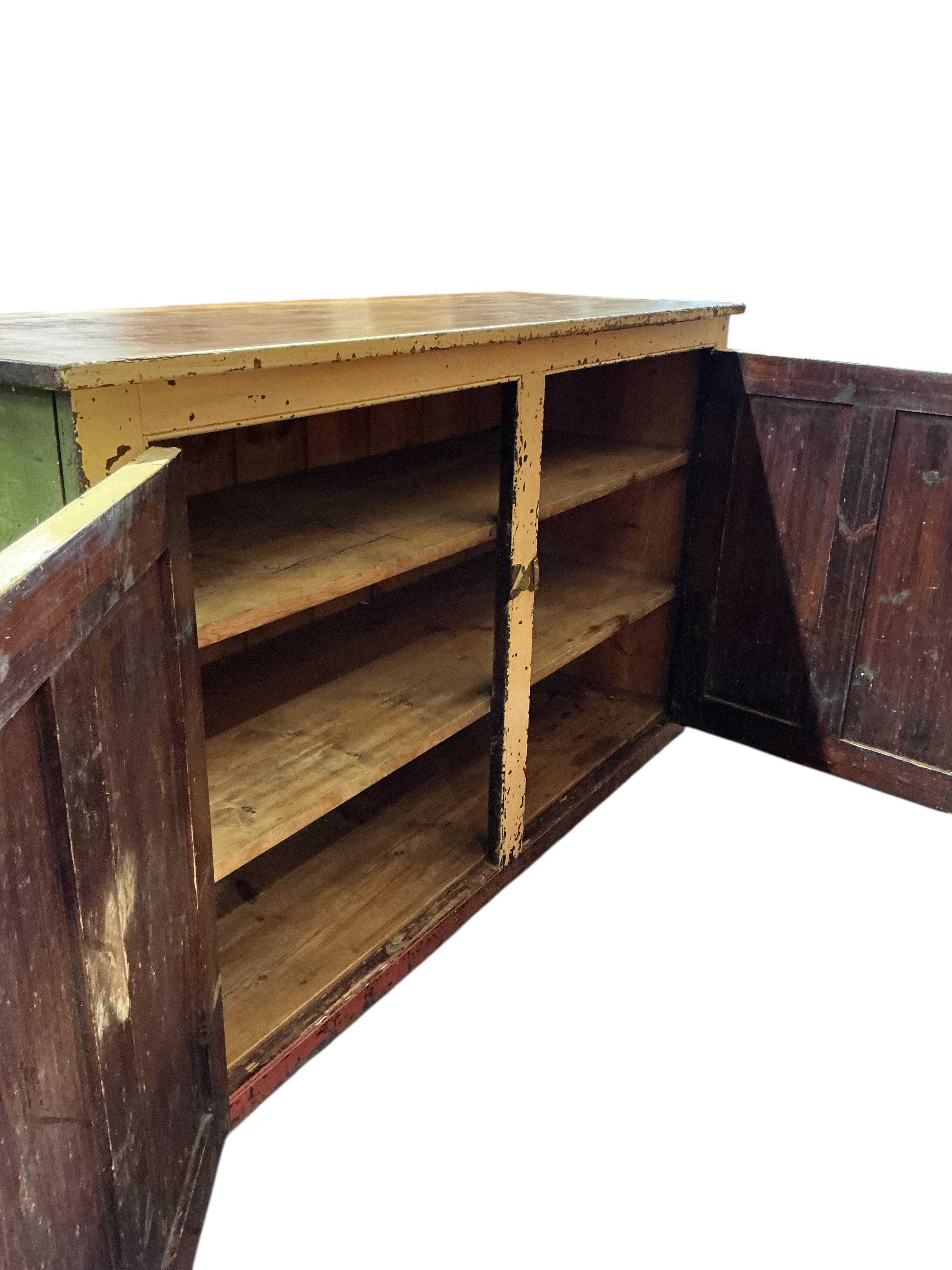 A Victorian painted pine two door household cabinet, width 152cm, depth 53cm, height 89cm